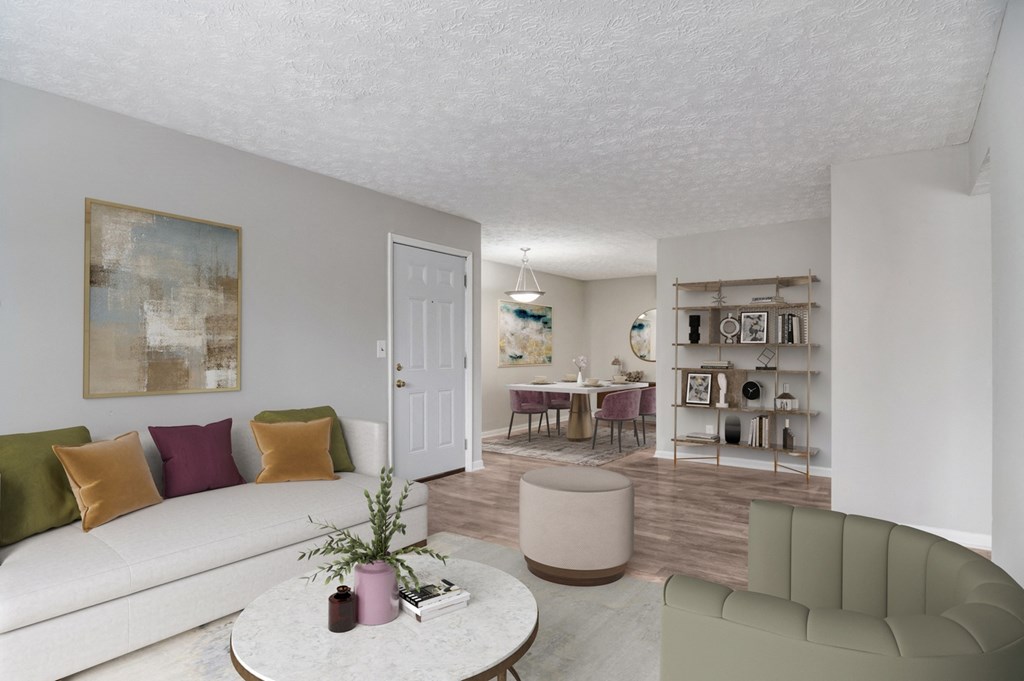 Affinitee at Pine Lake Apartments in Pine Lake, GA photo of a living room and dining room with a white couch and a table