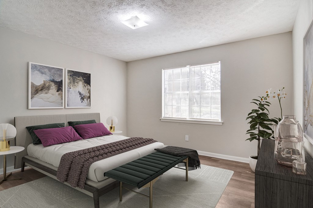 Affinitee at Pine Lake Apartments in Pine Lake, GA photo of a bedroom with a bed and a window
