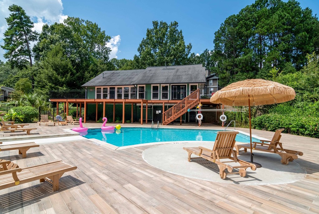 Affinitee at Stone Mountain Apartments photo of a swimming pool and a deck with chairs