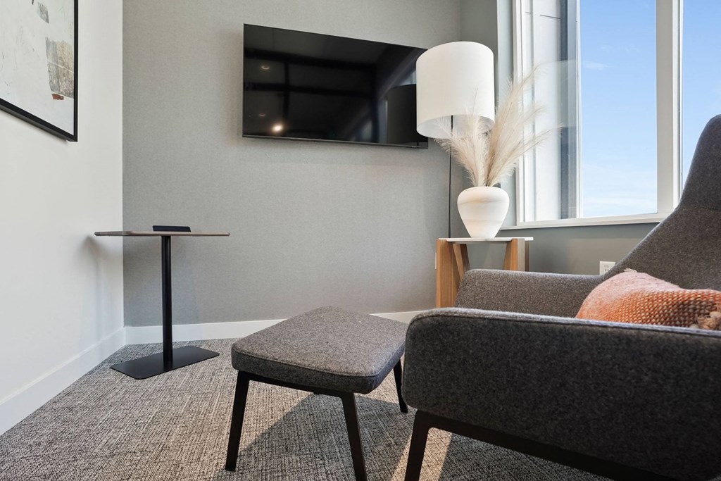 a living room with a couch and a chair