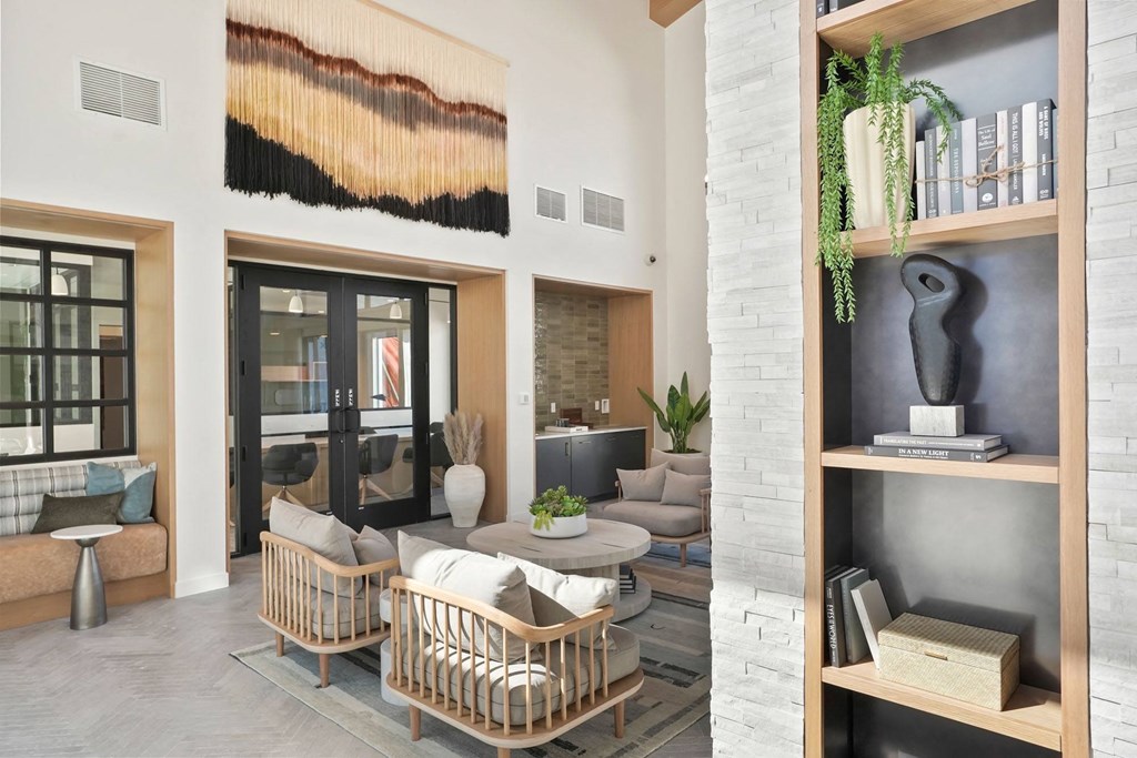 a living room filled with furniture and a large window