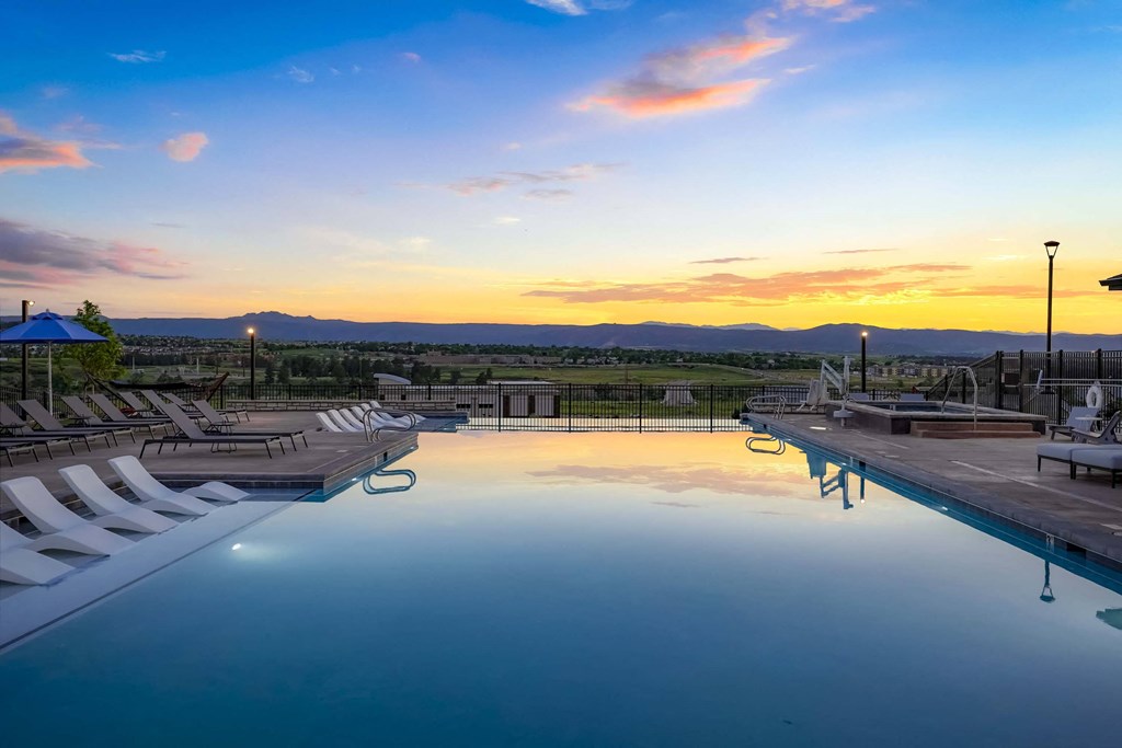 a swimming pool at sunset at the resort at governors crossing