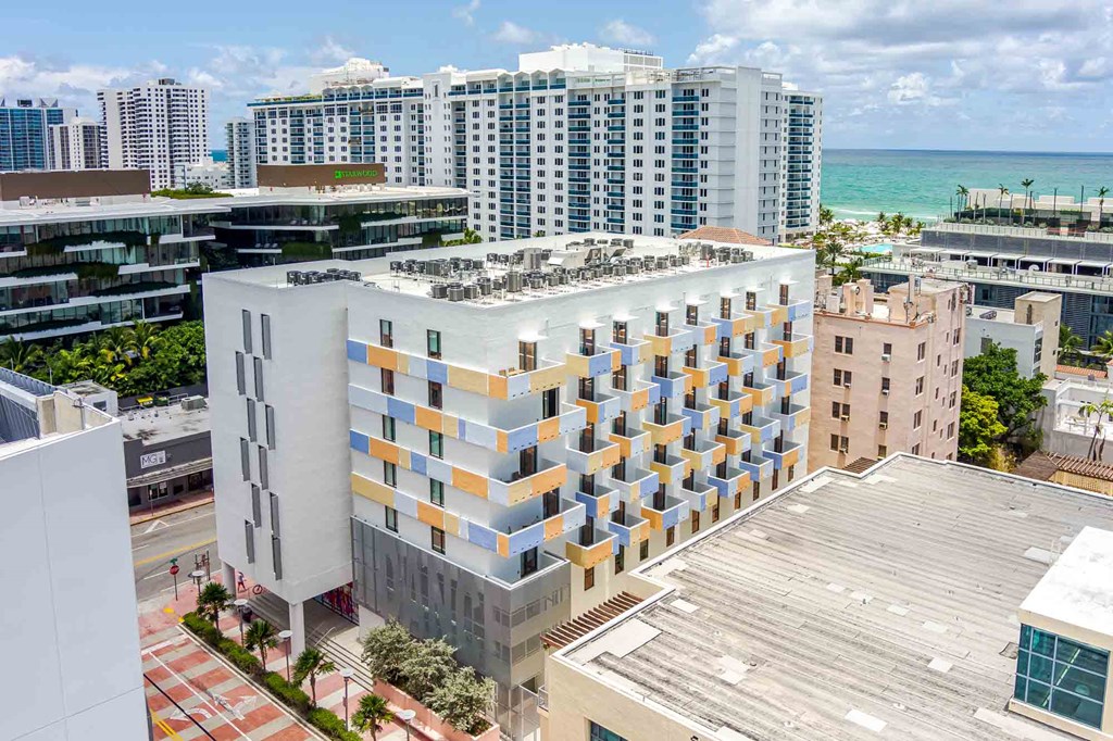 Bird’s-eye view of a Miami Beach apartment complex highlighting the urban setting and building layout.