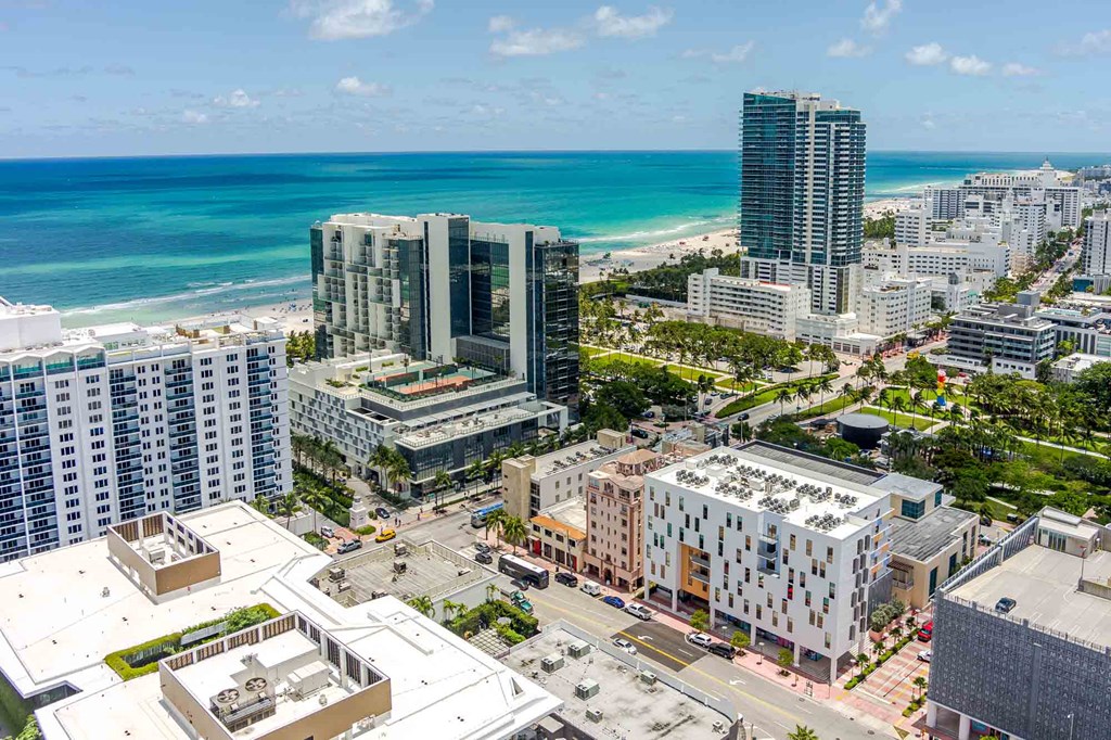 Cityscape view near The Anamar at Collins Park in Miami Beach, Florida, with buildings in the foreground and the beach in the background, highlighting the pet-friendly community's coastal location.