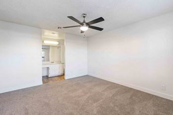 Arabella apartments in Henderson Nevada photo of bedroom with plush carpeting and ceiling fan - Photo Gallery 5