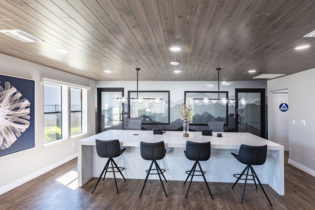 a kitchen and dining room with a large table and chairs