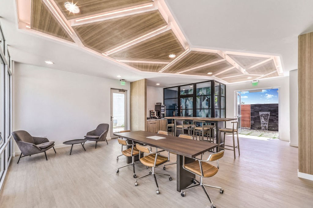 a room filled with furniture and a large window