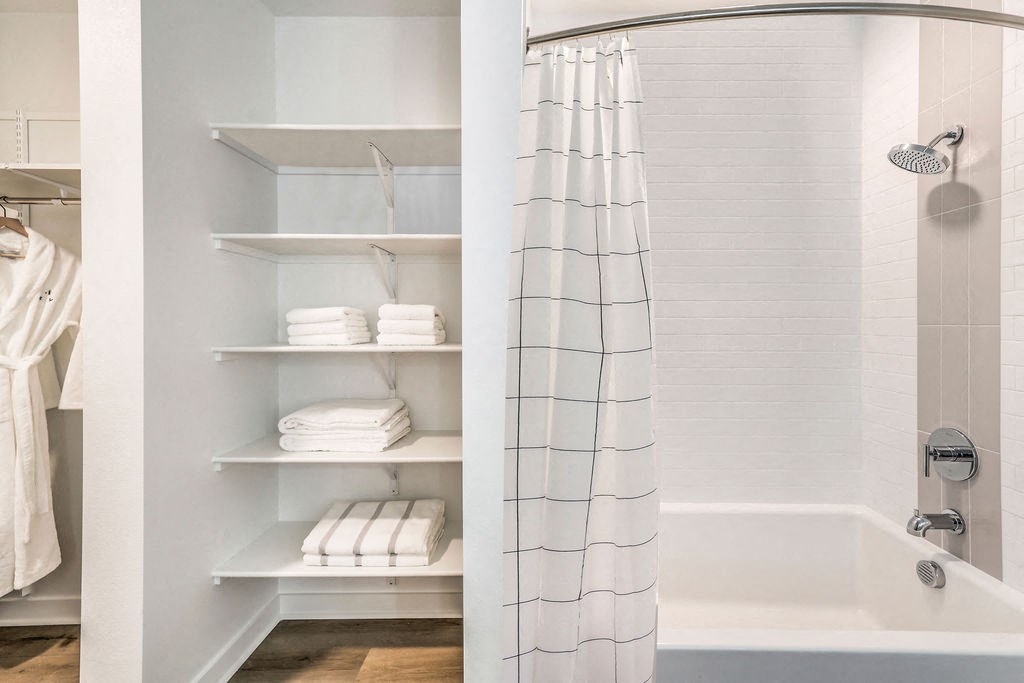 a bathroom with a shower and a bathtub