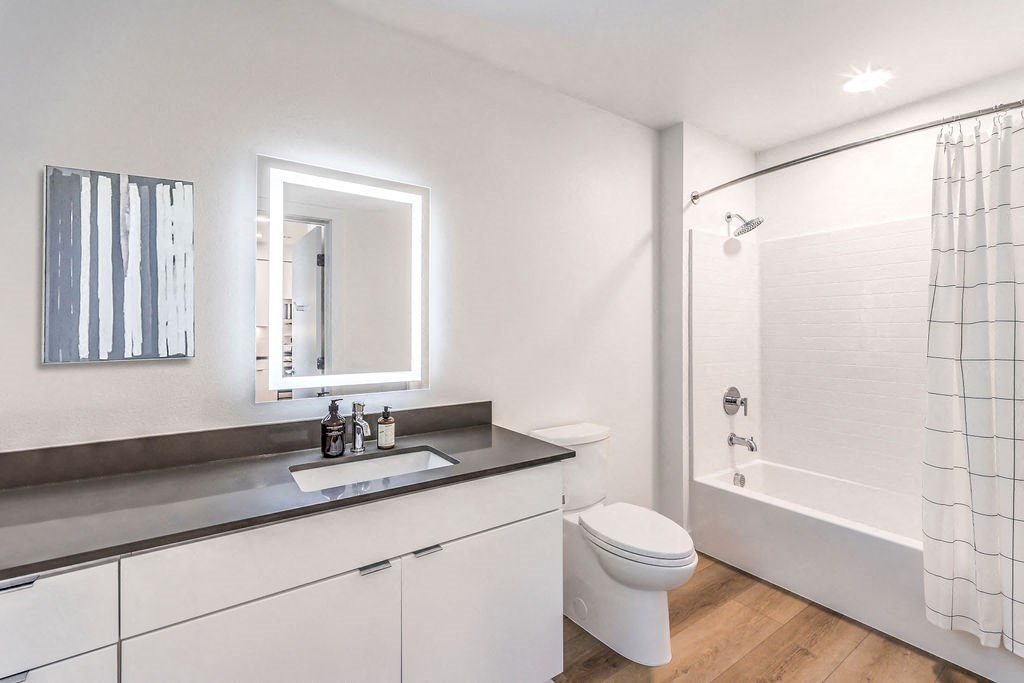 a bathroom with a toilet sink and bathtub
