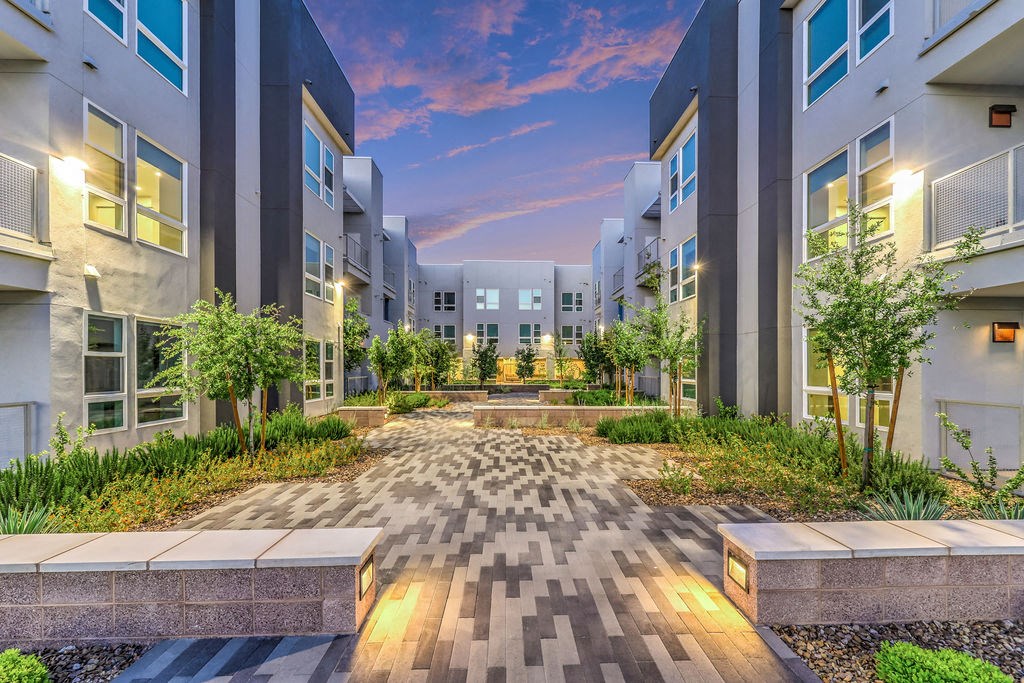 a view of an apartment complex at dusk