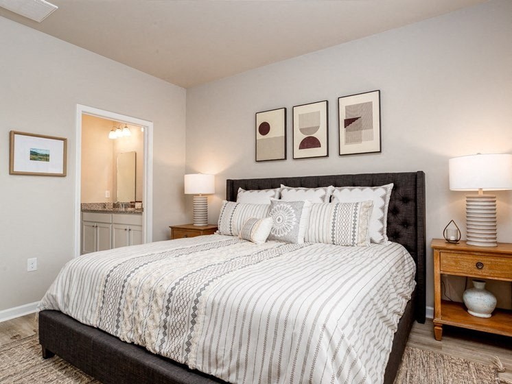 a bedroom with a bed and two night stands