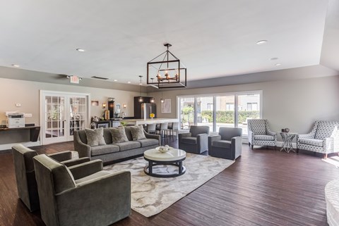 A living room with a grey couch and a coffee table.