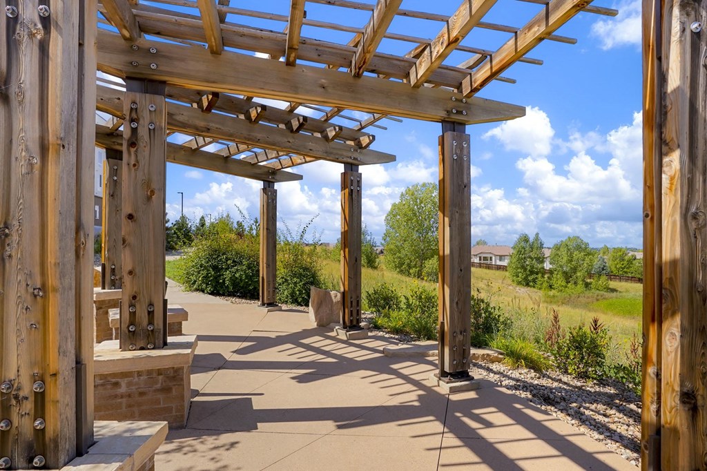 a covered walkway with a wooden structure