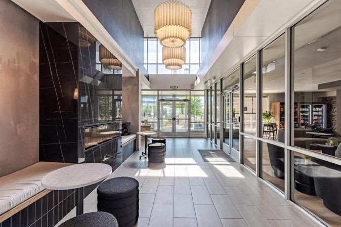 the lobby of a restaurant with tables and chairs