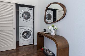 a small laundry room with a washer and a dryer