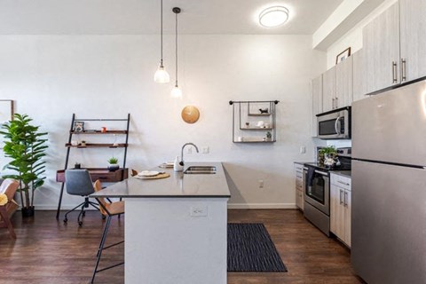 a kitchen with a counter top and a refrigerator