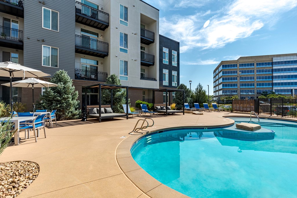 our apartments have a large pool and lounge areas with umbrellas