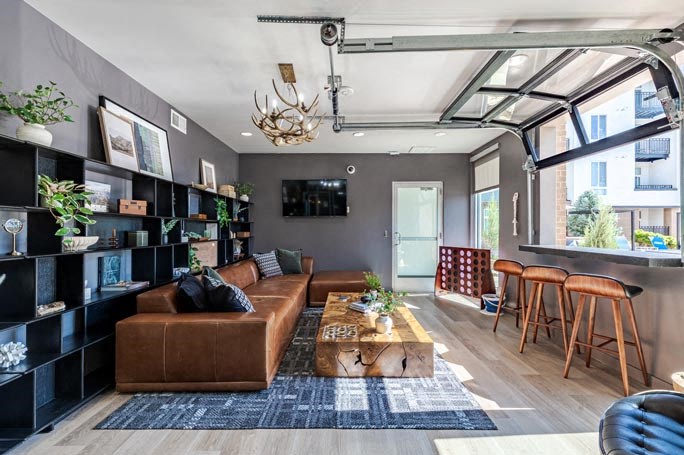 a living room with a brown couch and a coffee table