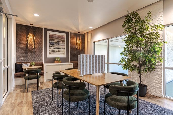 a dining room with a table and chairs
