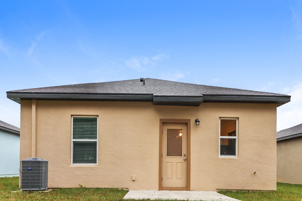 A small house with a brown door and a brown roof.