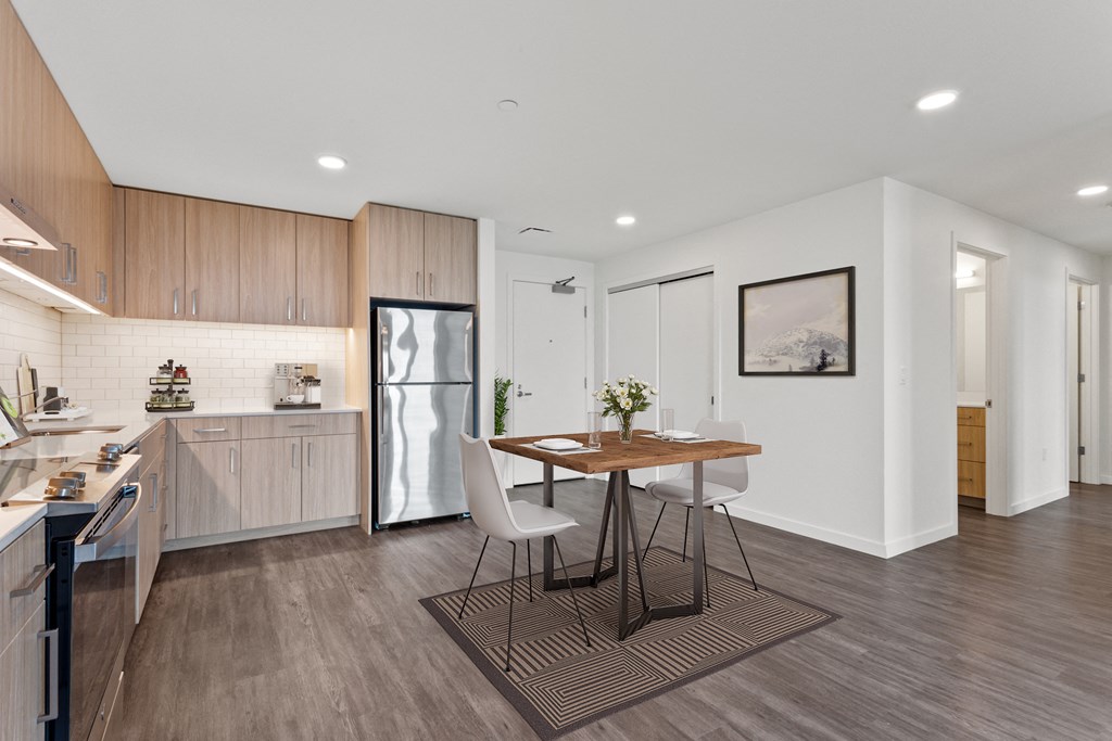 a kitchen and dining area in a 555 waverly unit