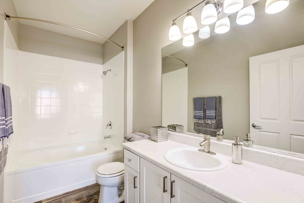 Henderson Apartments-Avalon at Seven Hills Bathroom with Gorgeous Lighting, a Large Shower and Tub Area, and Spacious Vanity Area