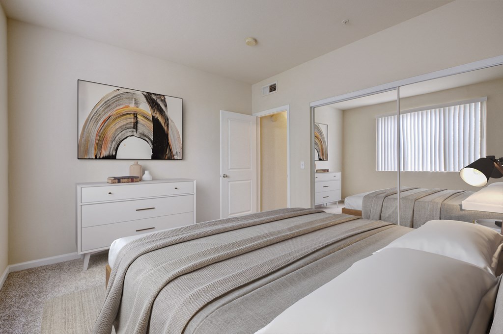 3-Bedroom Apartments in Sacramento, CA - Avanti - Bedroom with Plush Carpeting, Full-Size Bed, Dresser, Double Mirror Closet Doors, and Wall Art