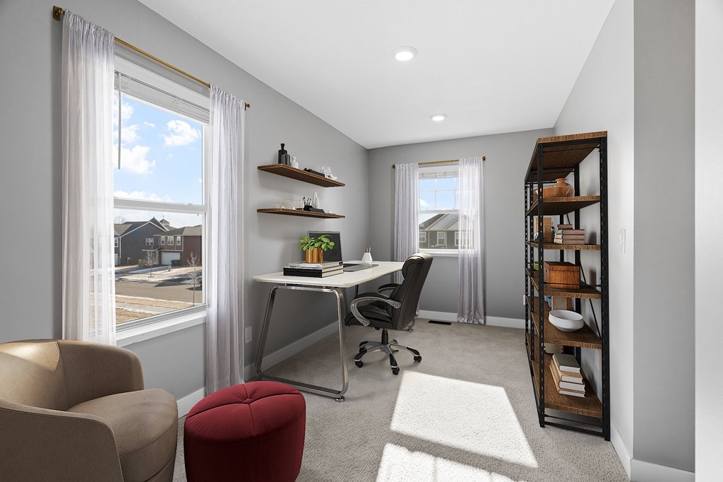 A modern home office with a desk, chair, and shelves.