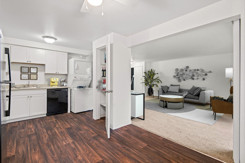 a living room with a kitchen and a dining room