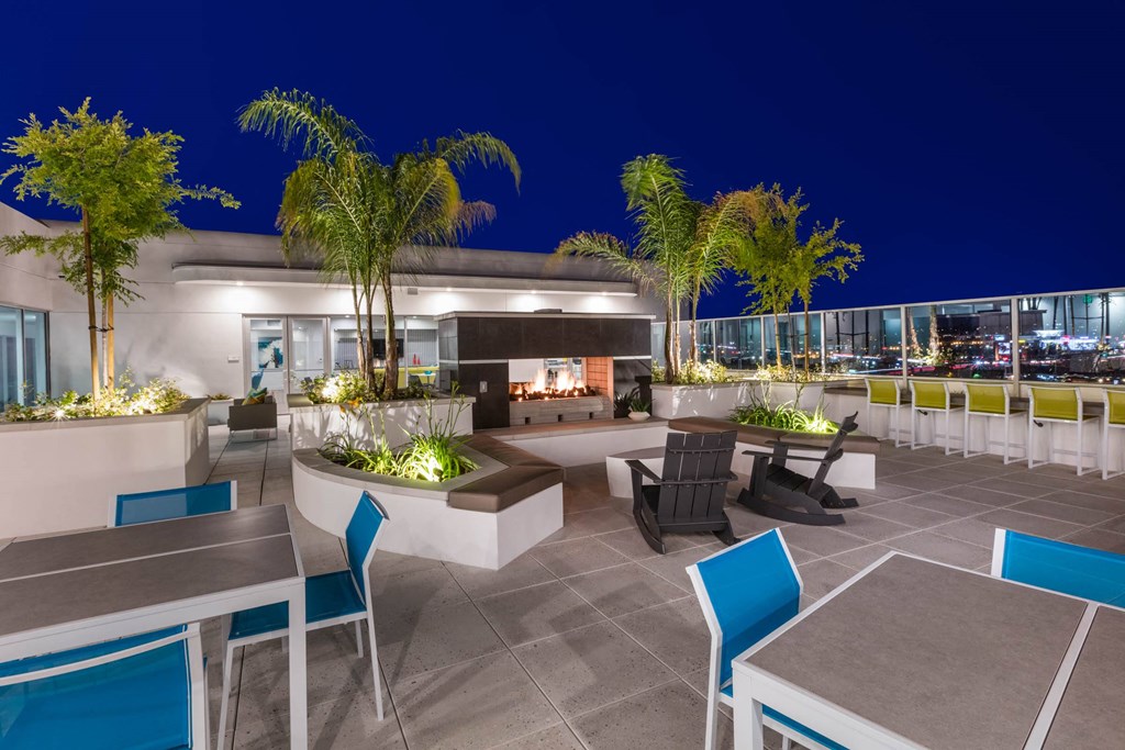 a rendering of a rooftop patio with tables and chairs