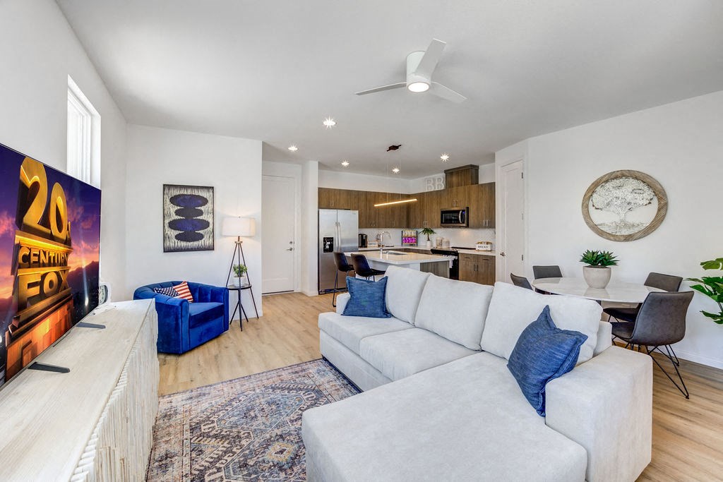 a living room with a white couch and a fireplace