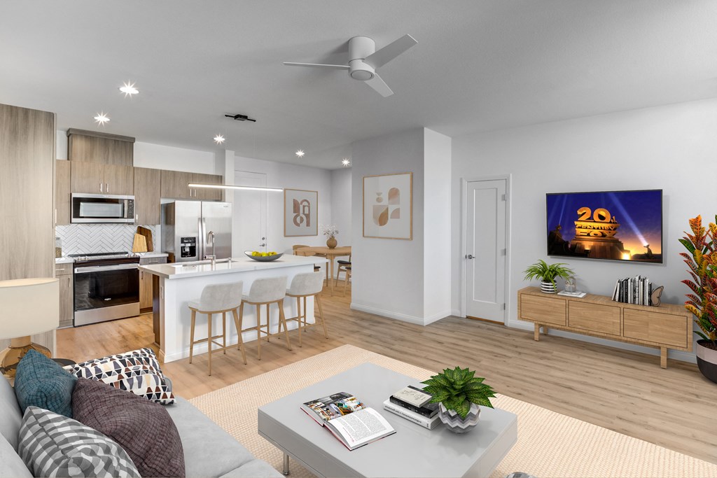 an open living room with a kitchen and a dining room