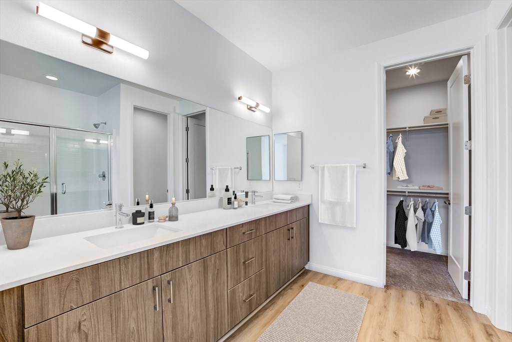 a bathroom with two sinks and a large mirror