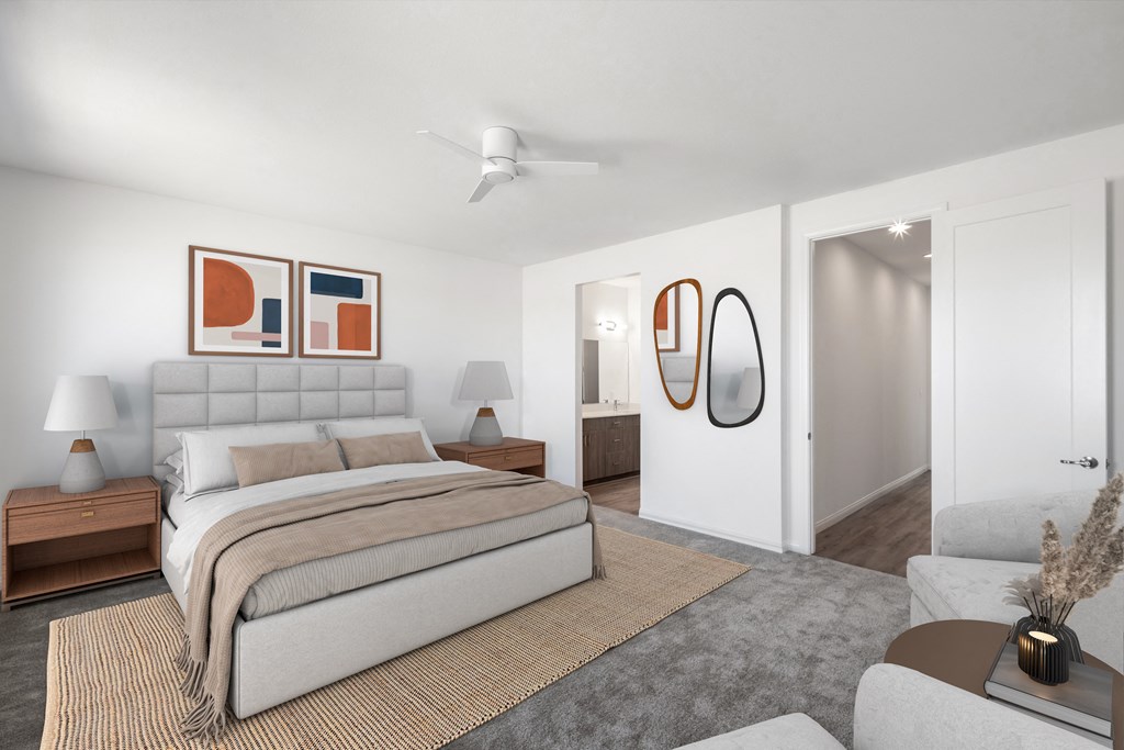 a bedroom with white walls and a bed and a couch