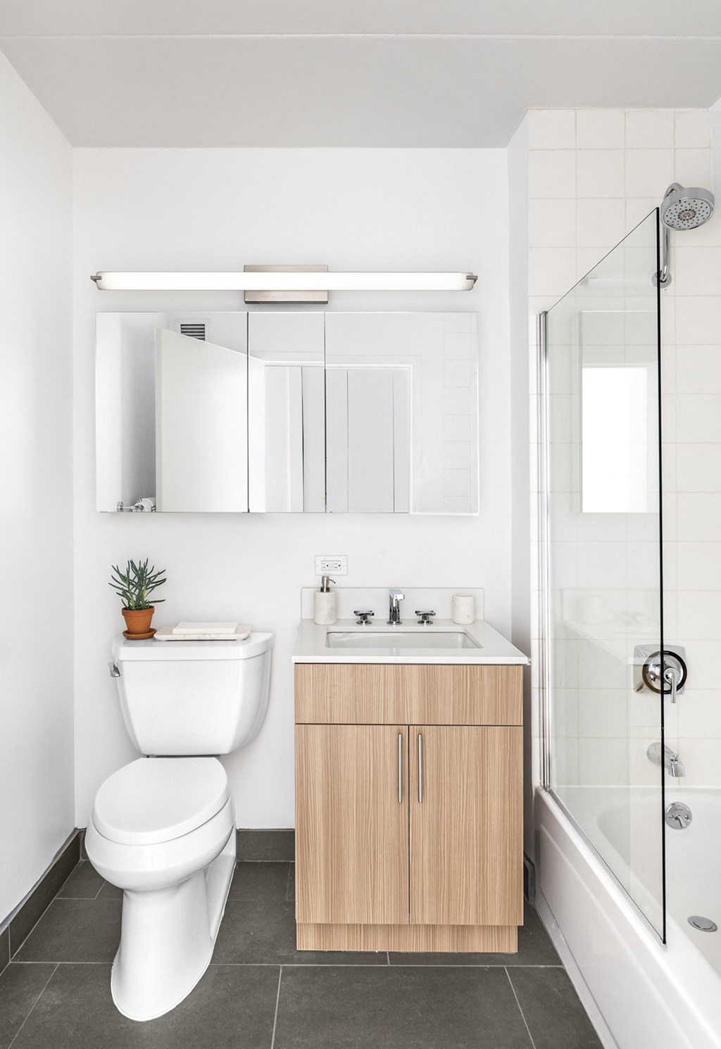 a small bathroom with a toilet sink and shower