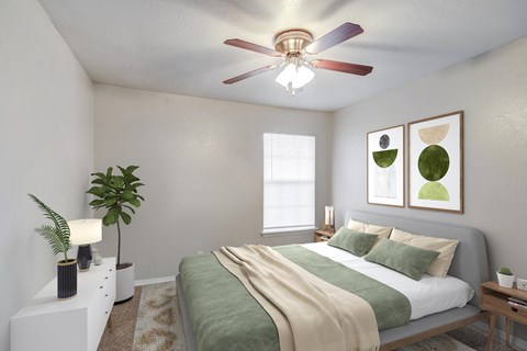 an empty bedroom with a bed and a ceiling fan
