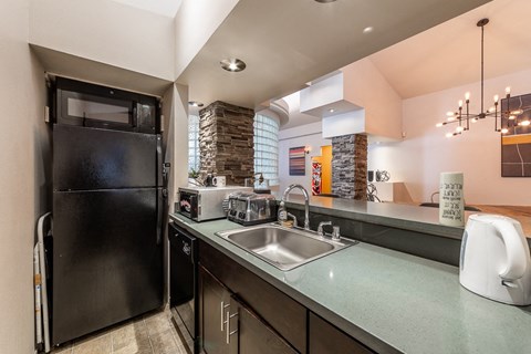 a kitchen with stainless steel appliances and a sink