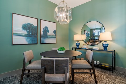 Elegant resident dining and gathering space at Blue Sky Landing apartments in College Park, GA with comfortable seating near Old National Highway, Camp Creek and Atlanta Airport.