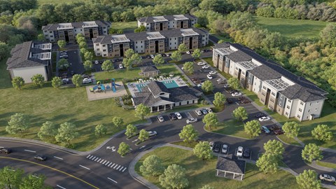 A large building complex with a parking lot in front.