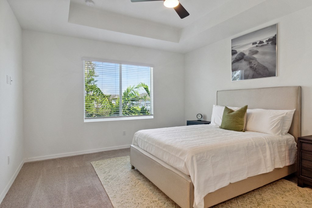Boatman Hammock Townhomes in Lake Worth, FL photo of an empty bedroom with a bed and a window