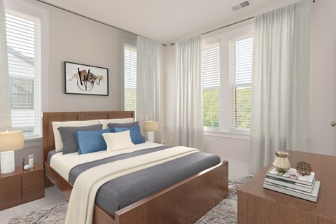 A bedroom with a large bed and a painting on the wall.