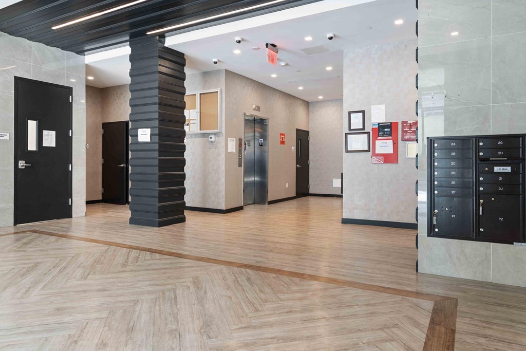 the lobby of a building with lockers and doors