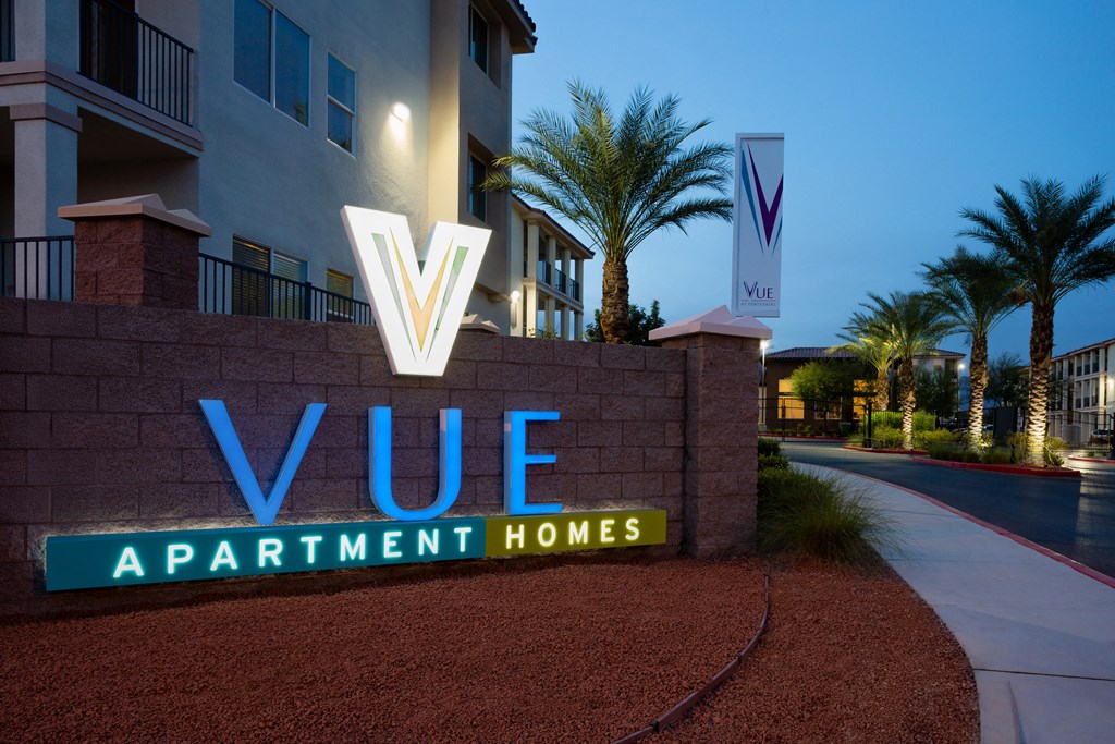 an image of the vue apartment homes sign at night