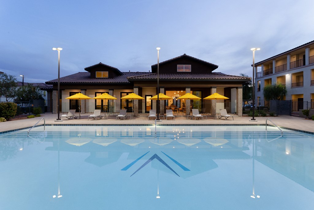 a swimming pool with a building in the background