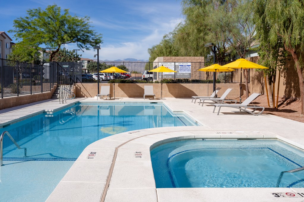 our apartments have a resort style pool and lounge chairs