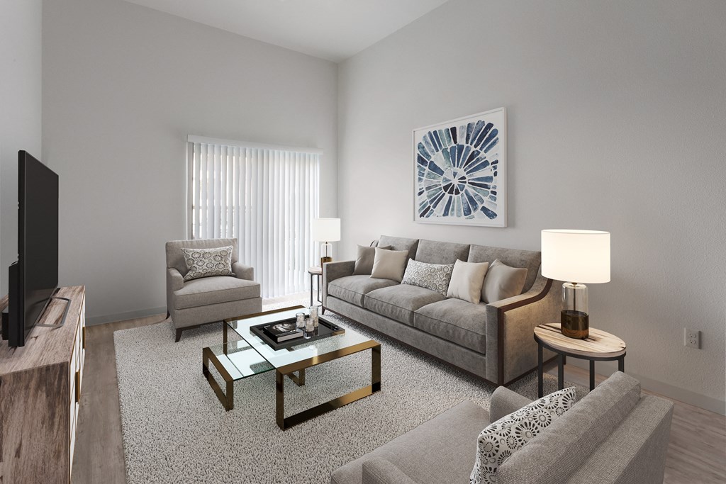 a living room with a couch and two chairs