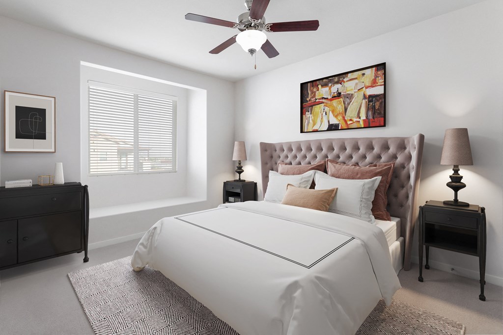 a bedroom with a bed and a ceiling fan