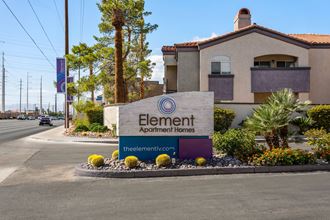a building with a sign that reads element apartment homes