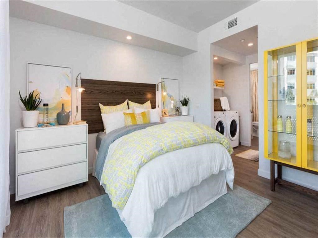 a bedroom with a bed and a closet