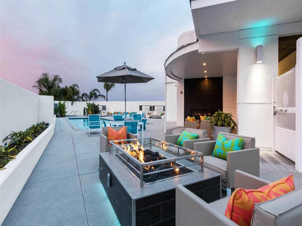 a fire pit on the patio of a house